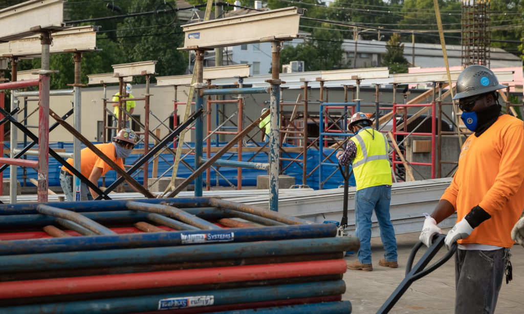 A group of construction workers on an outdoor jobsite