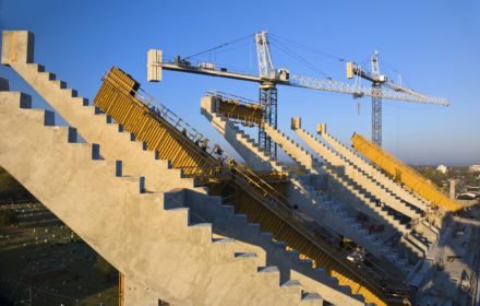 South End Zone Expansion project with cranes towering over large concrete stadium seating our crews self-performed