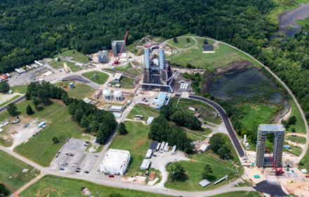 An aerial view of a construction site where two space launch system test stands are under construction