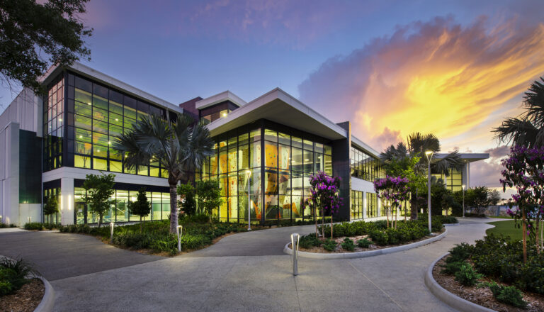 The exterior of a wellness facility pictured at sunset