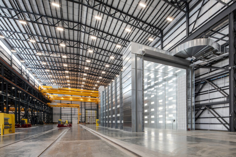 Interior of a large, modern cryogenic facility in Theodore, Alabama with high ceilings and overhead cranes