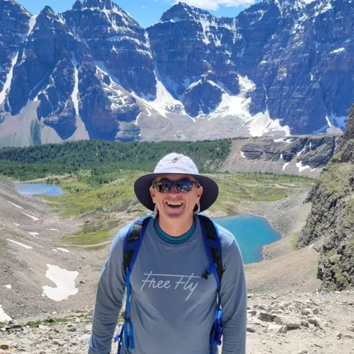 Eric Perkinson, wearing a sun hat, sunglasses, and a 