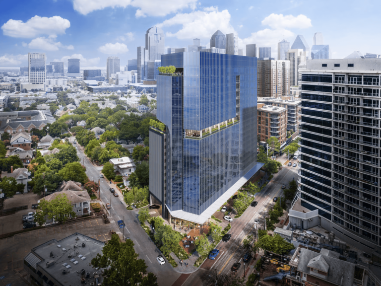 A modern glass high-rise building, 2626 McKinney, with green rooftop terraces stands among trees and other city buildings in Dallas under a partly cloudy sky. This impressive structure exemplifies the craftsmanship of Brasfield & Gorrie.