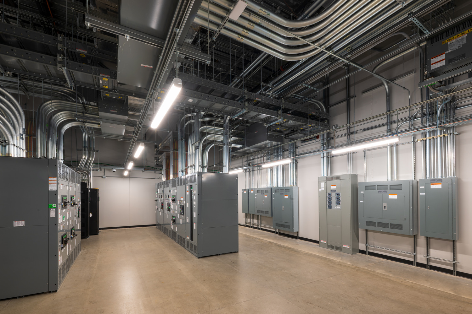 Electrical Room containing Low Voltage Switchgear, Mechanical UPS, and Panelboards